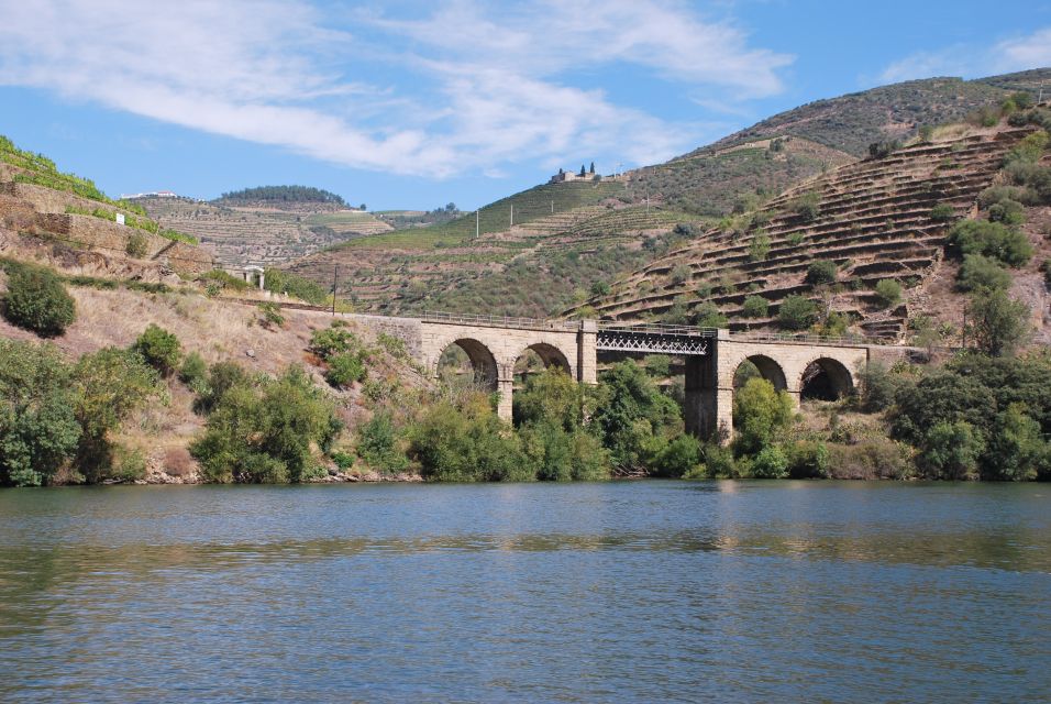 Pinhão: Private Rabelo Boat Tour along the River Douro - First minutes on the Douro: the Eiffel iron bridge moment