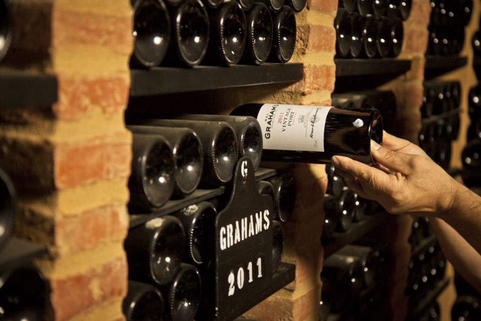 Porto: Graham's Port Lodge Tour with Premium Wine Tastings - Price and value: $47 for a guide, a working cellar, and three pours