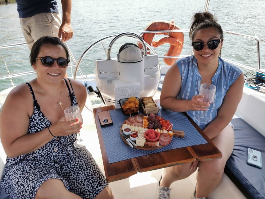 Porto: Private Sailboat Trip with Wine Tasting & Charcuterie - The main tasting moment at Ponte D. Luiz I: cheeses, charcuterie, jams