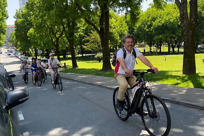 Private Electric Bike Tour in Oporto - Crossing the Eiffel-era bridge and riding the river edge
